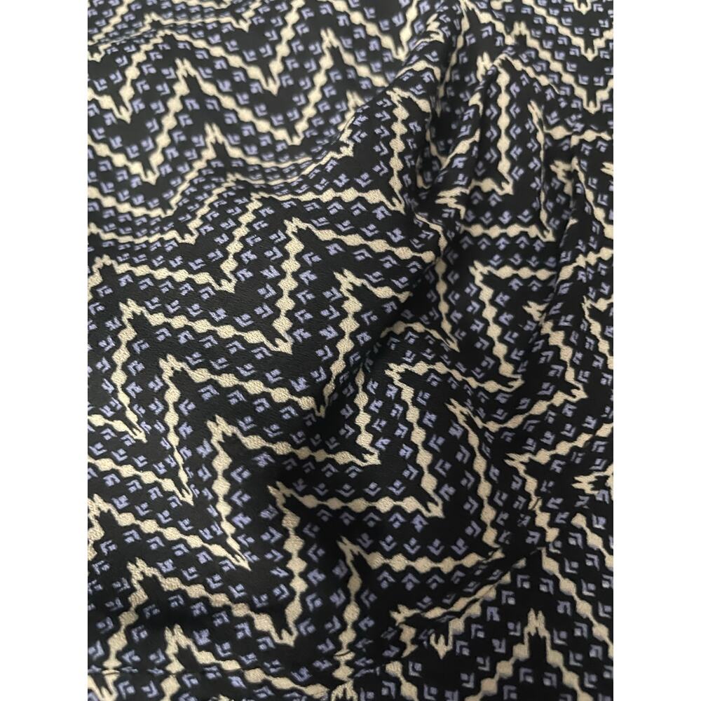 Geometric loose long sleeve top w solid stripe on sleeve w rear laced neck Lg